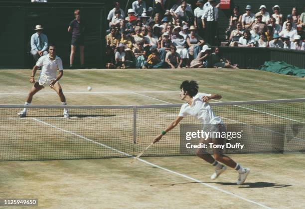 Raul Ramírez of Mexico makes a forehand return against Ilie Nastase of Romania during their Men's Singles Semi - Final match at the Wimbledon Lawn...
