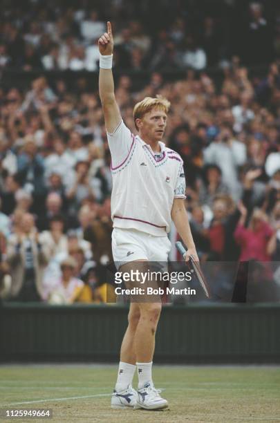Boris Becker of Germany signals match point after winning the Men's Singles Final of the Wimbledon Lawn Tennis Championship against Stefan Edberg on...