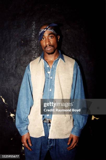 Rapper Tupac Shakur poses for photos backstage after his performance at the Regal Theater in Chicago, Illinois in March 1994.