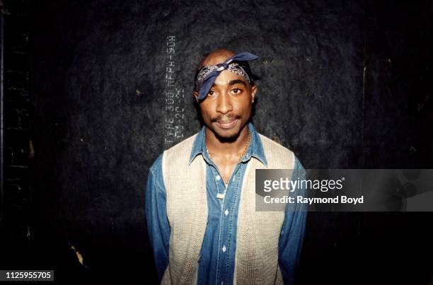 Rapper Tupac Shakur poses for photos backstage after his performance at the Regal Theater in Chicago, Illinois in March 1994.