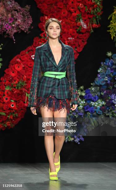 Model walks the runway at the Roberta Einer show during London Fashion Week February 2019 at the BFC show space on February 19, 2019 in London,...