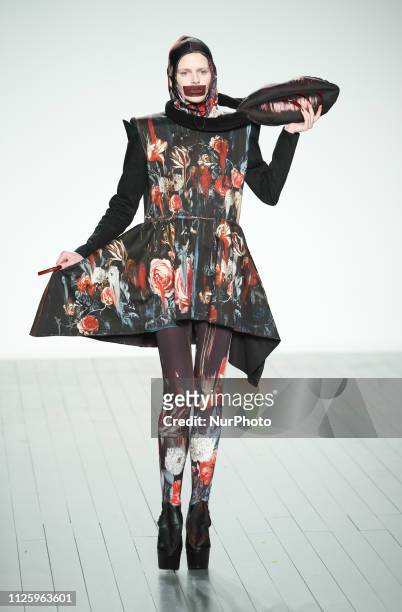 Model walks the runway at the On Off Presents show during London Fashion Week February 2019 at the BFC show space on February 19, 2019 in London,...