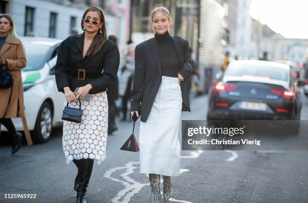 Danielle Bernstein is seen wearing black belted jacket, white skirt and Josefine Haaning Jensen outside MUF10 during the Copenhagen Fashion Week...