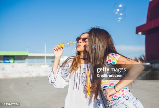 blowing bubbles - human mouth stock pictures, royalty-free photos & images