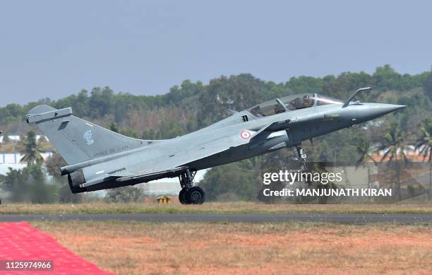 Dassault's Rafale fighter jet lands after a flying display during the inaugural day of the five-day Aero India 2019 airshow at the Yelahanka Air...