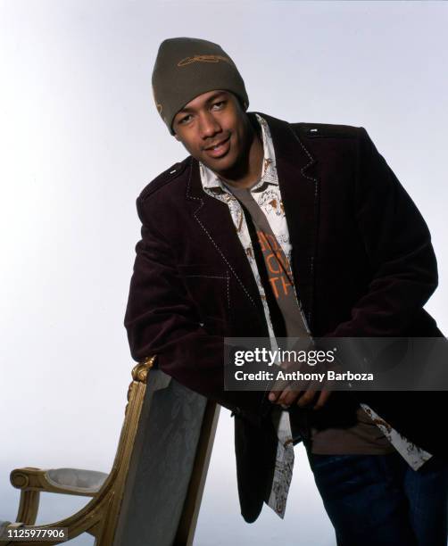 Portrait of American actor and singer Nick Cannon as he poses against a white background during a portrait session, New York, 1990s.