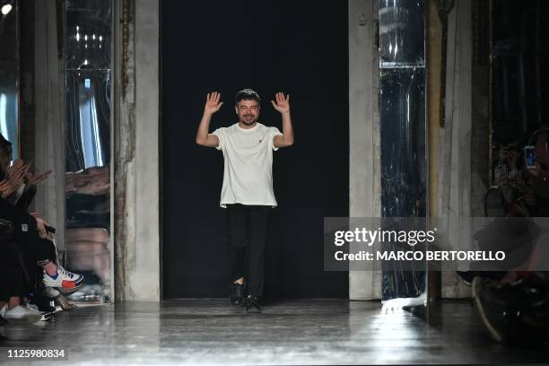 Fashion designer Alberto Zambelli acknowledges applause following his women's Fall/Winter 2019/2020 collection fashion show, on February 20, 2019 in...