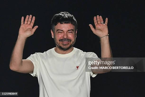 Fashion designer Alberto Zambelli acknowledges applause following his women's Fall/Winter 2019/2020 collection fashion show, on February 20, 2019 in...