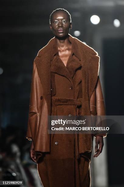 Model presents a creation during the Zambelli women's Fall/Winter 2019/2020 collection fashion show, on February 20, 2019 in Milan.
