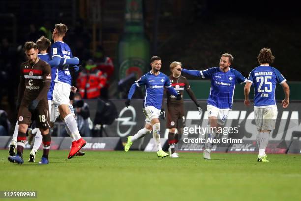 Marcel Heller of Darmstadt celebrates his team's first goal with team mates during the Second Bundesliga match between SV Darmstadt 98 and FC St....