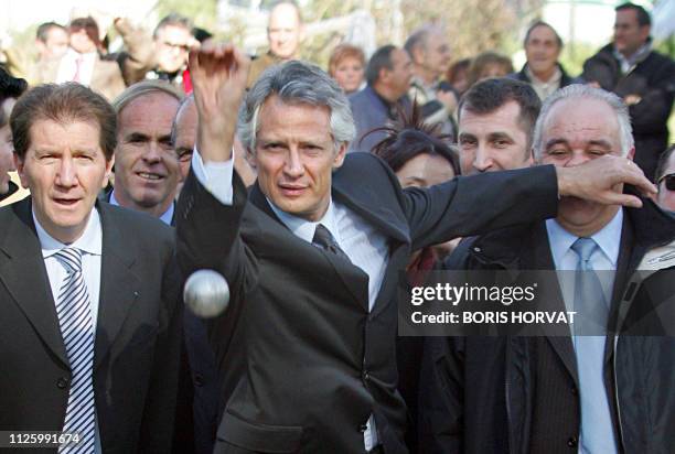 French Prime minister Dominique de Villepin plays "petanque" , 03 March 2006 in Marseille, Southern France, as he visits the Saint-Loup social...