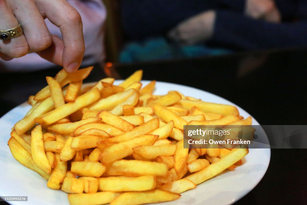 A plate of French fried potatoes in a Paris bistro