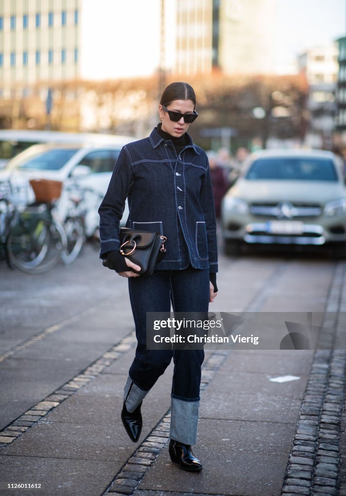 Elisa Schenke is seen wearing cuffed dark blue denim jeans, denim ...