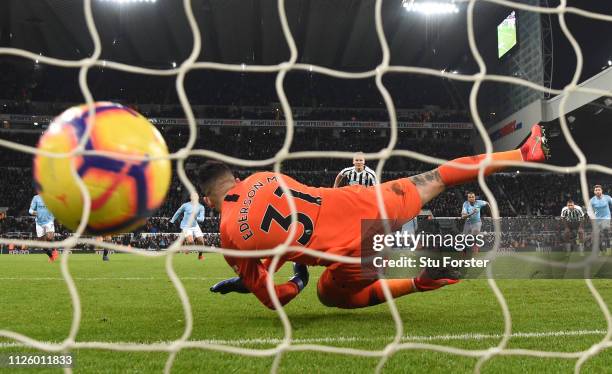 Newcastle player Matt Ritchie scores the winning goal from the penalty spot past Manchester City goalkeeper Ederson during the Premier League match...