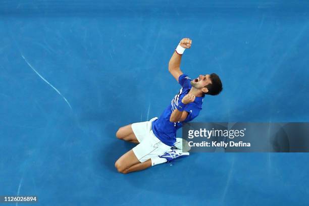 Novak Djokovic of Serbia celebrates championship point in his Men's Singles Final match against Rafael Nadal of Spain during day 14 of the 2019...