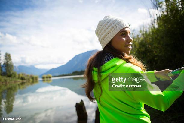 indigenous canadian woman fishing - eskimo stock pictures, royalty-free photos & images