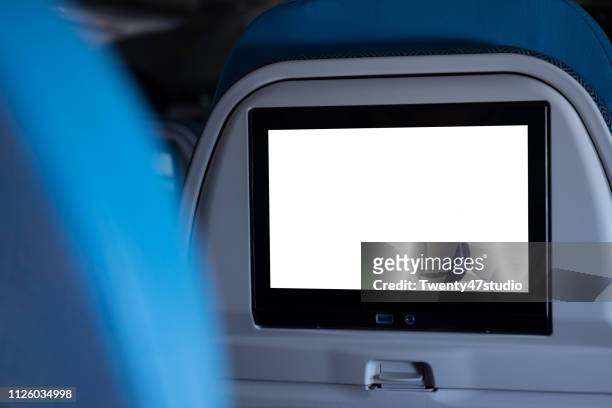 crop image of airplane screen device for entertainment to serve passenger - seat stock pictures, royalty-free photos & images