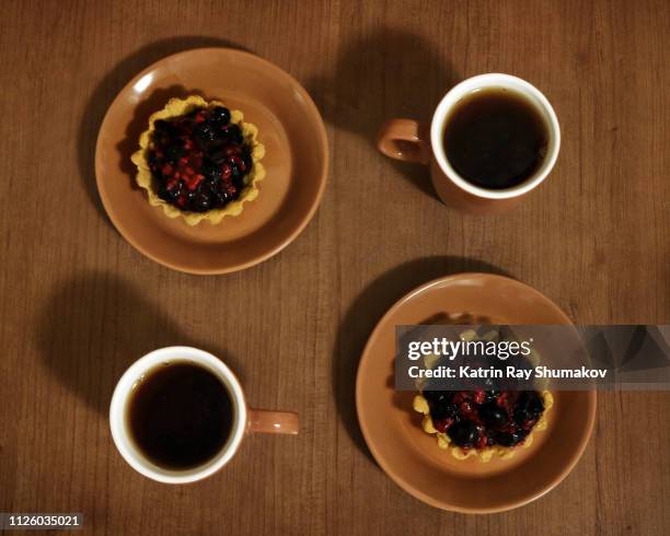 gluten-free raspberry-blueberry tartles - blueberry pie stock pictures, royalty-free photos & images