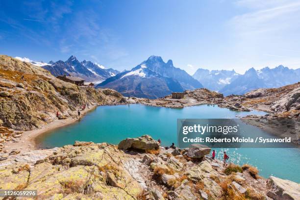 hikers at lac blanc, chamonix, france - french landscape stock pictures, royalty-free photos & images