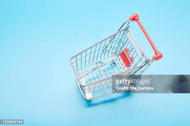 still life of a small shopping cart - shopping trolleys stock pictures, royalty-free photos & images
