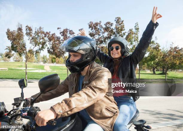 cheerful young couple road trip - motorbike riding stock pictures, royalty-free photos & images