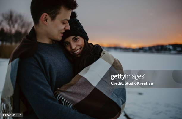 couples camping in winter at the lake - broiling stock pictures, royalty-free photos & images