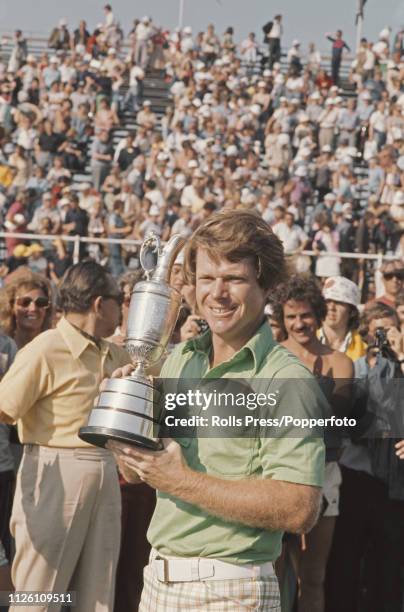 American professional golfer Tom Watson holds the British Open Championship Trophy after finishing in first place to win the 1977 Open Championship...