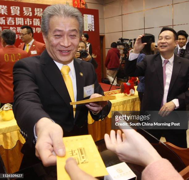 Haywood Cheung Tak-hay, President of The Chinese Gold & Silver Exchange Society, greets traders at the Chinese Gold and Silver Exchange Society debut...