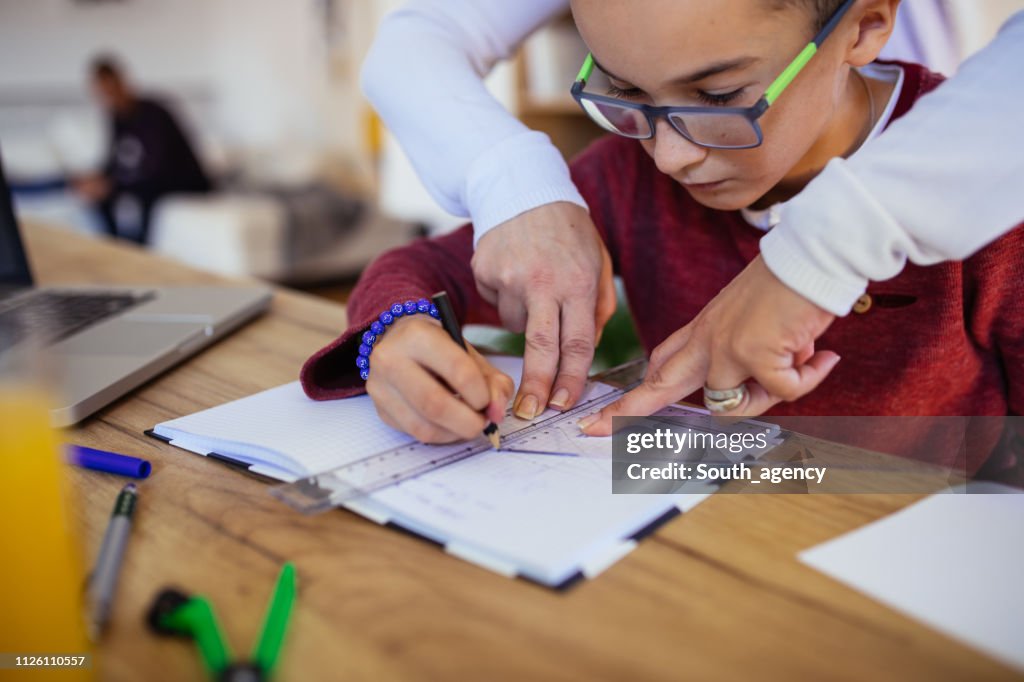 Mother Doing Math Problem Mom Helping Son With Math High-Res Stock Photo - Getty Images