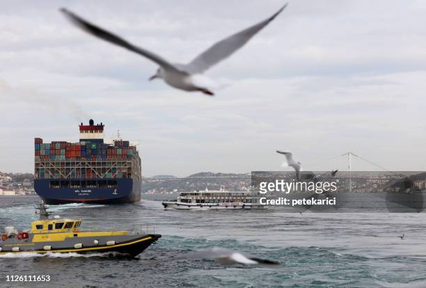 cargo tank passing the bosphorus bridge in istanbul, turkey - tank barge stock pictures, royalty-free photos & images