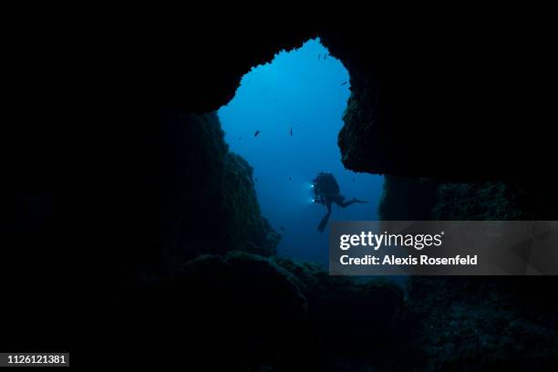 Scuba diver entering an underwater cave, on august 02, 2017 in Marseille, France. The Mediterranean represents a hotspot of marine biodiversity. With...