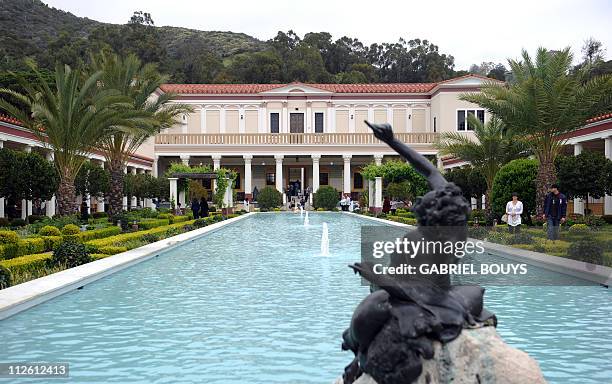 Visitors enjoy the garden at the Getty Villa Museum in Malibu, California on April 18, 2011. The Getty Villa exhibits classical antiquities...