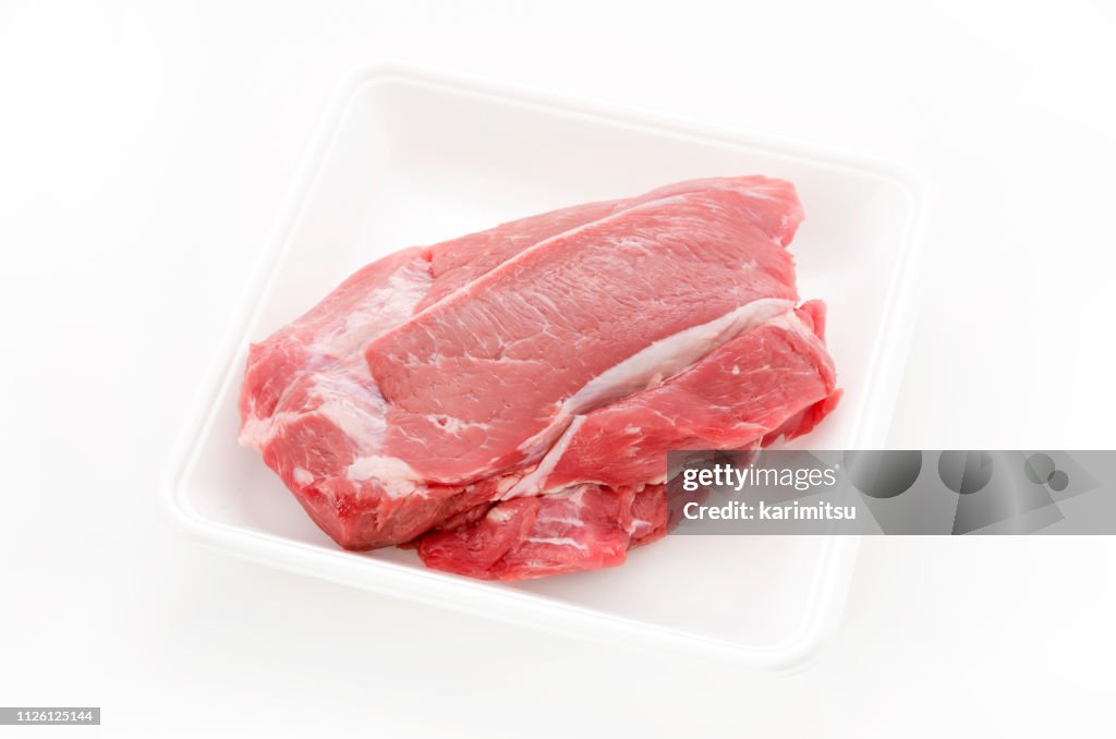 Raw Pork meat on foam tray white background