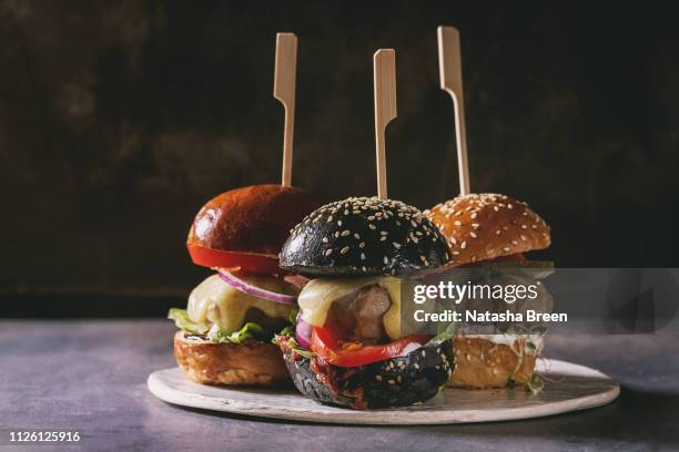 homemade burgers variety - häppchen stock-fotos und bilder