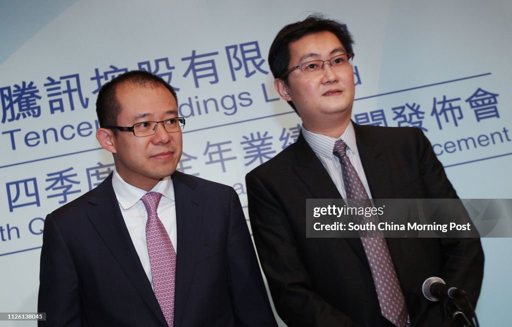 (L-R) Martin Lau Chi-ping, President; and Pony Ma Huateng, Chairman and CEO, Tencent Holdings Limited, speak during a press conference to announce his company's 2013 fourth quarter and annual results. 19MAR14