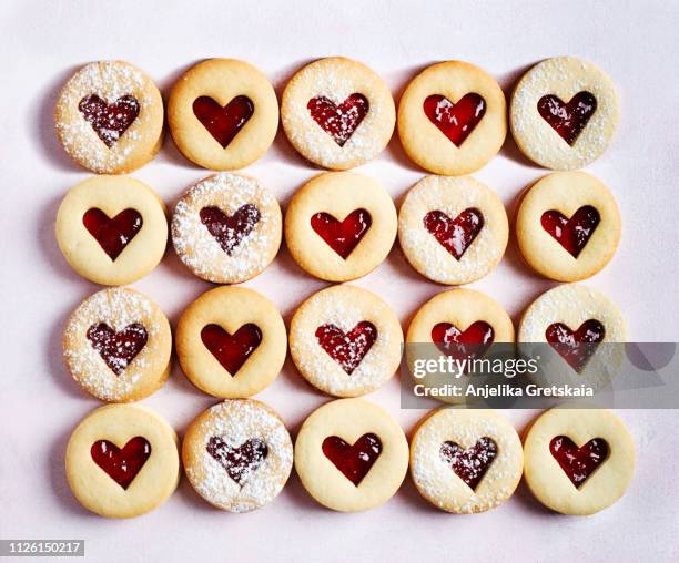 traditional linzer cookie with strawberry jam - sugar cookie stock pictures, royalty-free photos & images
