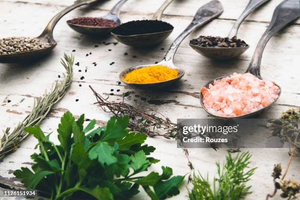 intensive condiments on old spoons - food additive stock pictures, royalty-free photos & images