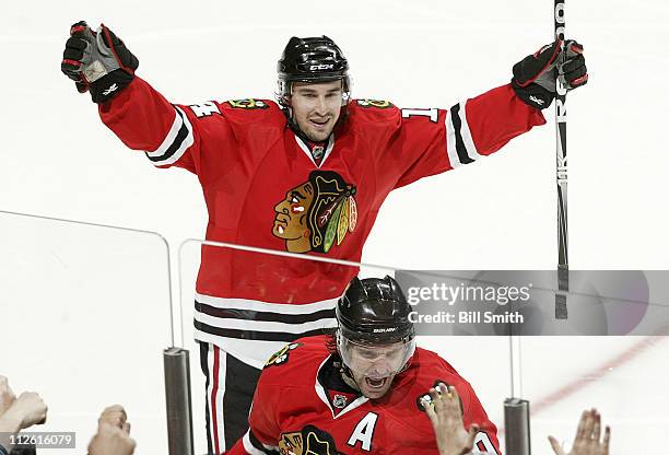 Patrick Sharp of the Chicago Blackhawks and as teammate Chris Campoli celebrate Sharp's goal against the Vancouver Canucks in Game Four of the...