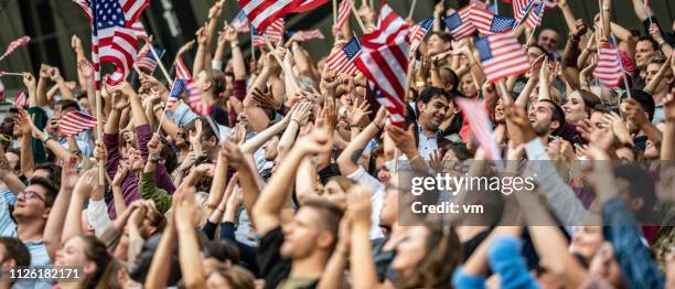 usa fans waving flags - crowd cheering olympics stock pictures, royalty-free photos & images