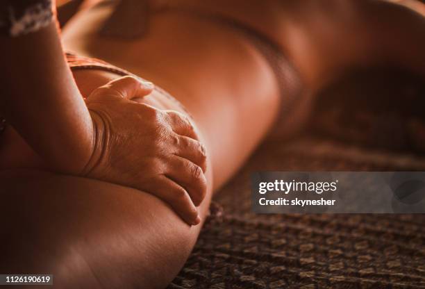 close up of therapist giving shiatsu massage to her customer. - beautiful bums imagens e fotografias de stock