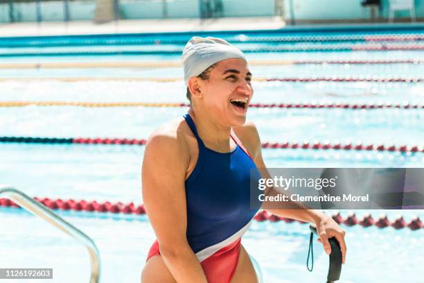 athlete smiling getting out of the pool - showus fitness stock pictures, royalty-free photos & images
