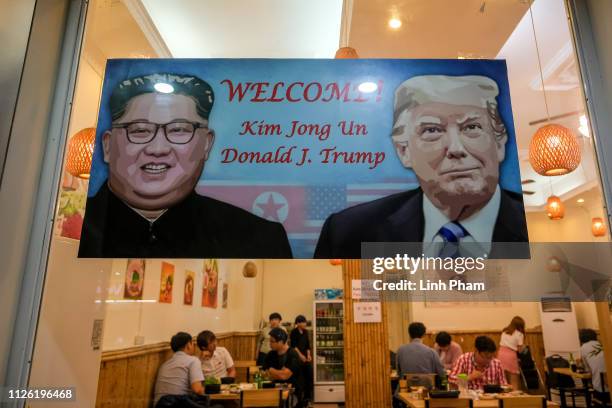 Signboard welcomes the upcoming summit between U.S. President Donald Trump and North Korean leader Kim Jong Un at South Korean restaurant in Tu Liem...