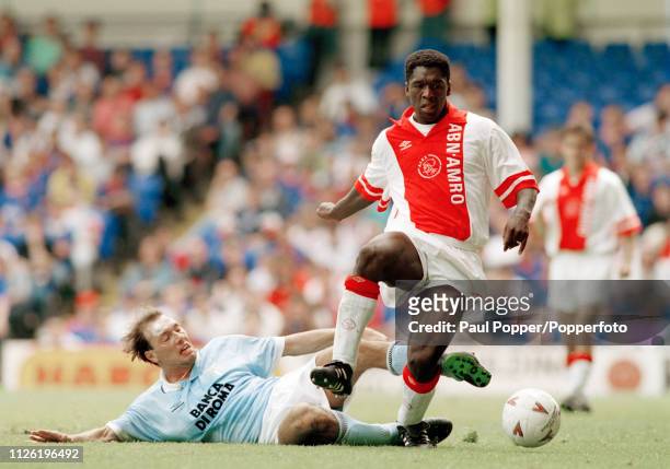 Clarence Seedorf of Ajax is tackled by Dario Marcolin of Lazio during a Makita Tournament match at White Hart Lane on August 1, 1993 in London,...