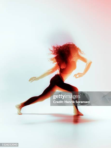 female dancer in motion - long exposure dancer stock-fotos und bilder