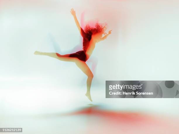 female dancer in motion - long exposure dancer stock-fotos und bilder