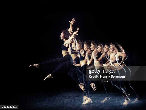 female dancer in multiple motion - long exposure dance stock pictures, royalty-free photos & images