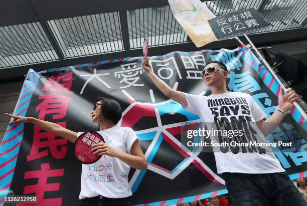 Canto-pop singers Denise Ho Wan-see and Anthony Wong Yiu-ming join the march in the streets to demand universal suffrage in Hong Kong. 01JUL14