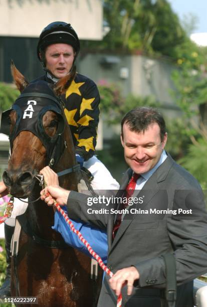 Race 4 winner horse no. 3 Tom's First with jockey Shane Dye and trainer David Hayes in the HORSE RACING AT SHA TIN RACECOURSE.