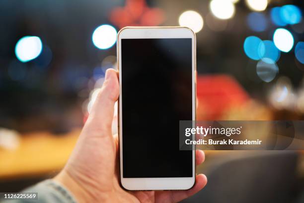 girl using smart phone - hand white background stock pictures, royalty-free photos & images