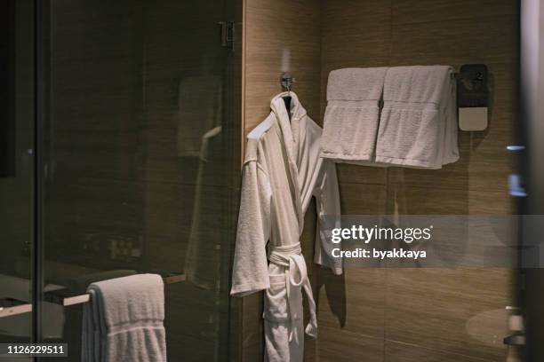 bathrobe towel bath - robe stock pictures, royalty-free photos & images